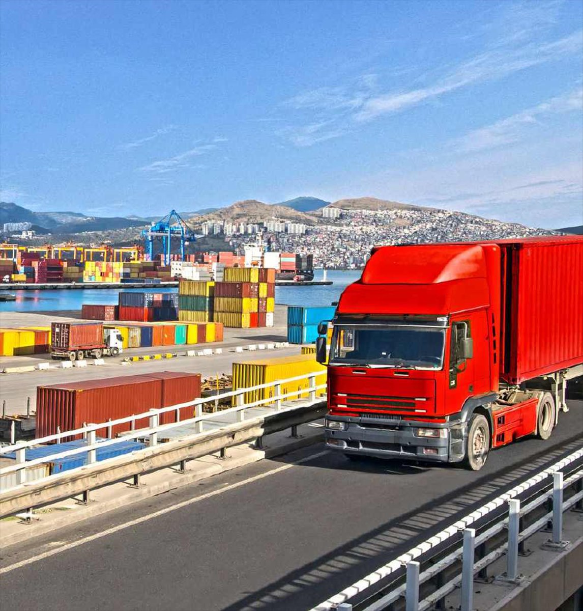 Land freight truck at port with containers